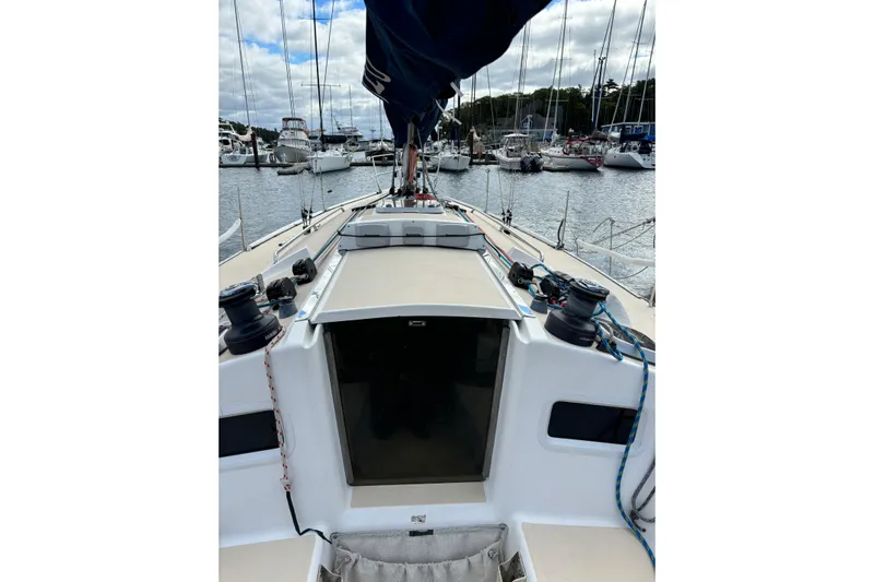 Jane Yacht Photos Pics 2002 J Boats J/120 sailboat docked in a marina, view from the deck.