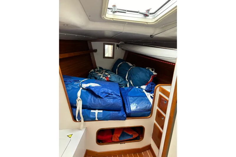 Jane Yacht Photos Pics Interior of 2002 J Boats J/120 sailboat with blue sails stored.