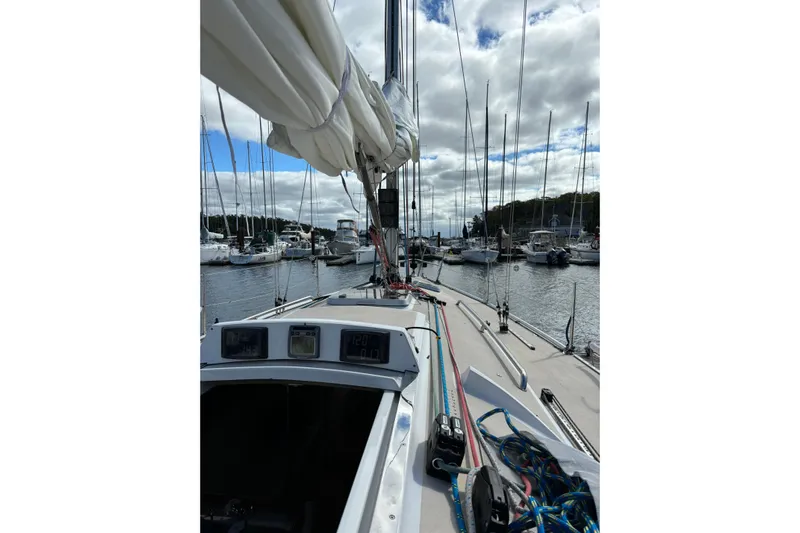 Jane Yacht Photos Pics Sailboat J/120 from 2002 docked in a marina, with rigging and sails visible.