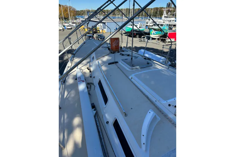 Jane Yacht Photos Pics 2002 J Boats J/120 sailboat deck view at marina, showcasing sleek design and equipment.