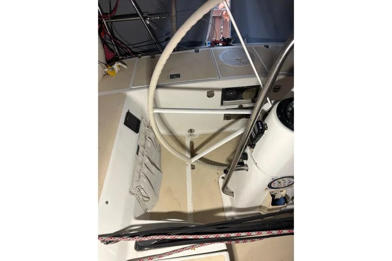 Jane Yacht Photos Pics Interior view of a 2002 J Boats J/120 sailboat cockpit with steering wheel and navigation instruments.