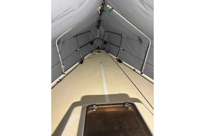 Jane Yacht Photos Pics Interior view of a 2002 J Boats J/120 sailboat under a protective cover.