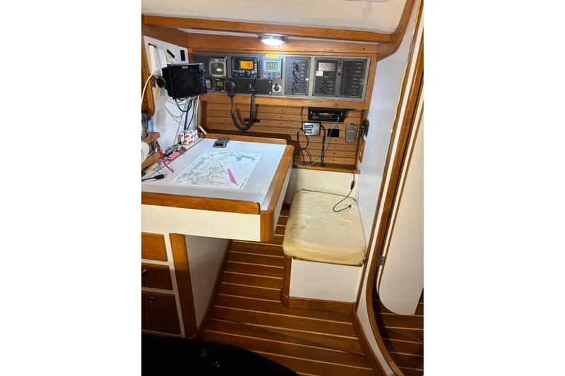 Jane Yacht Photos Pics Navigation station in 2002 J Boats J/120 sailboat with chart and communication equipment.