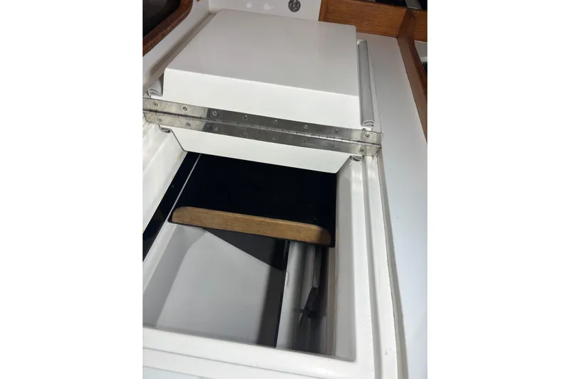 Jane Yacht Photos Pics Interior view of a 2002 J Boats J/120 sailboat, featuring a storage compartment.