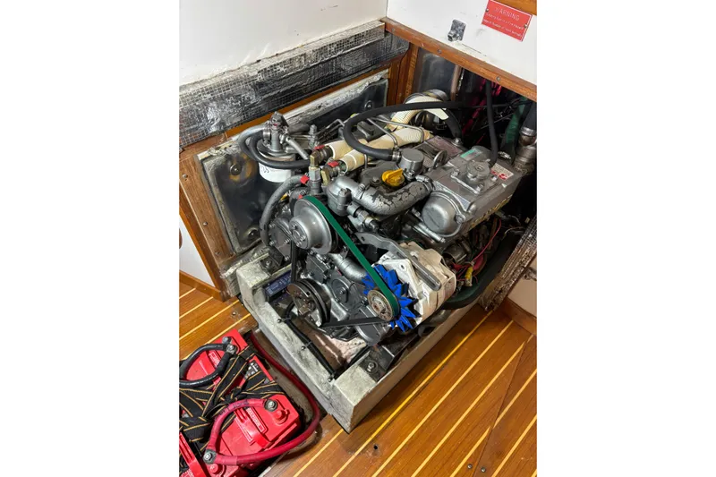 Jane Yacht Photos Pics Engine compartment of a 2002 J Boats J/120 sailboat, showcasing mechanical components.