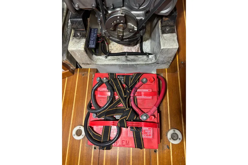 Jane Yacht Photos Pics Engine compartment of a 2002 J Boats J/120 with red battery and cables.