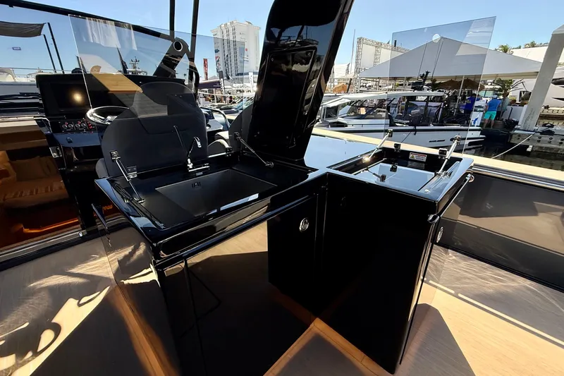 Yacht Photos Pics Luxury outdoor kitchen on 2026 Pardo Yachts 50, featuring sleek black surfaces and modern design.