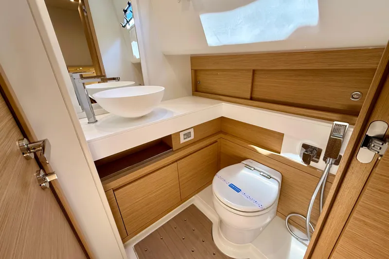  Yacht Photos Pics Modern bathroom in 2026 Pardo Yachts 50, featuring sleek wood cabinetry and contemporary fixtures.
