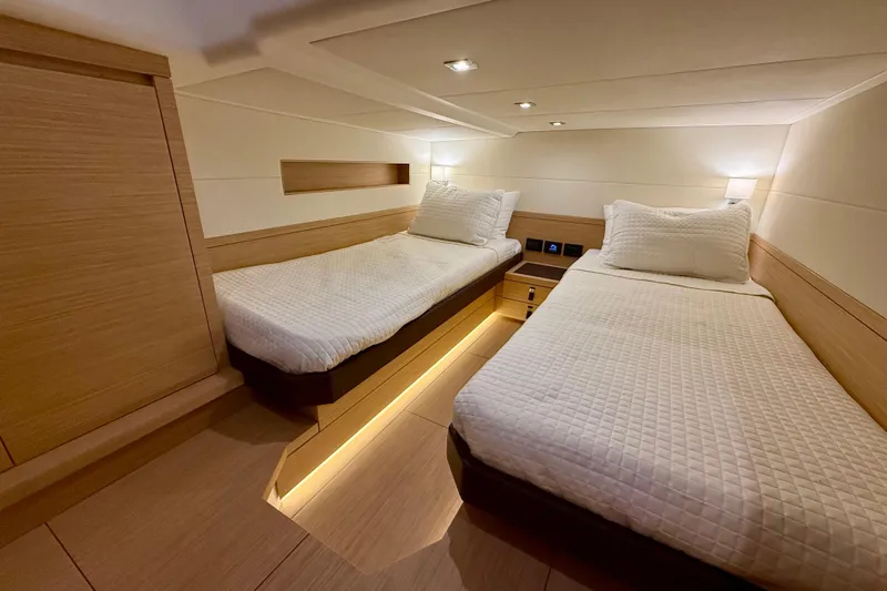  Yacht Photos Pics Luxurious twin cabin interior of 2026 Pardo Yachts 50, featuring modern design and ambient lighting.