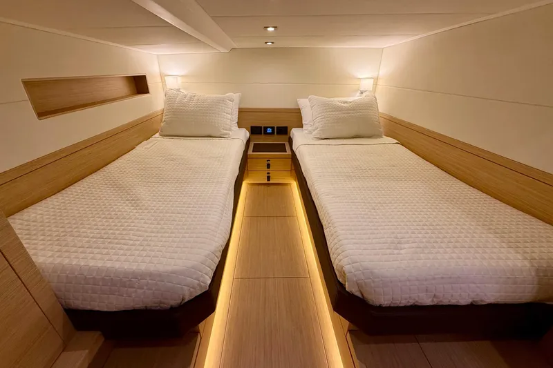  Yacht Photos Pics Luxurious twin cabin interior of 2026 Pardo Yachts 50, featuring elegant wood finishes.