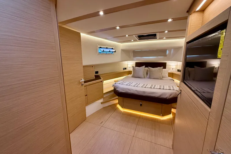  Yacht Photos Pics Luxurious interior of 2026 Pardo Yachts 50, featuring a modern bedroom with ambient lighting.