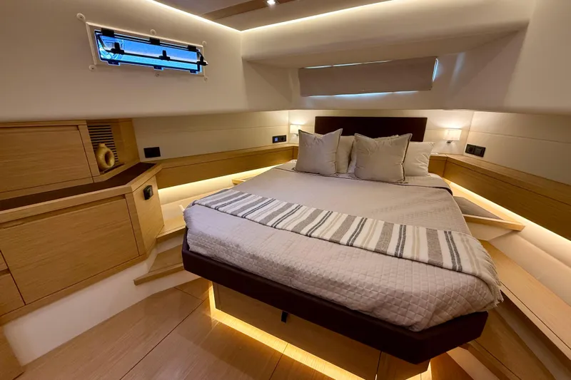  Yacht Photos Pics Luxurious bedroom interior of 2026 Pardo Yachts 50, featuring modern design and ambient lighting.
