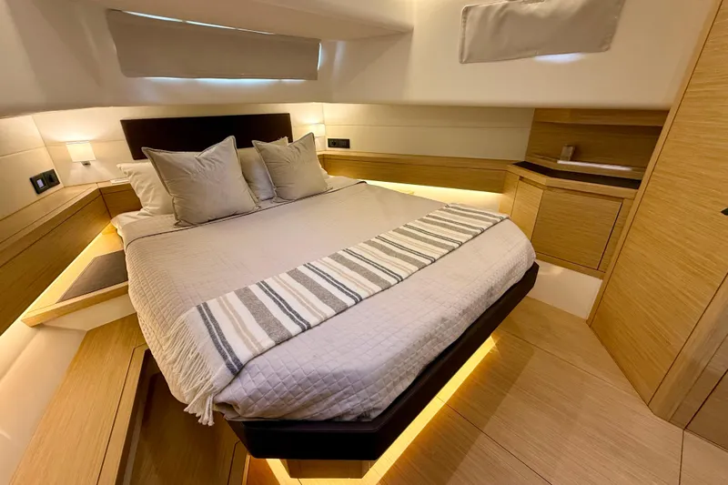  Yacht Photos Pics Luxurious bedroom interior of 2026 Pardo Yachts 50, featuring modern design and cozy ambiance.