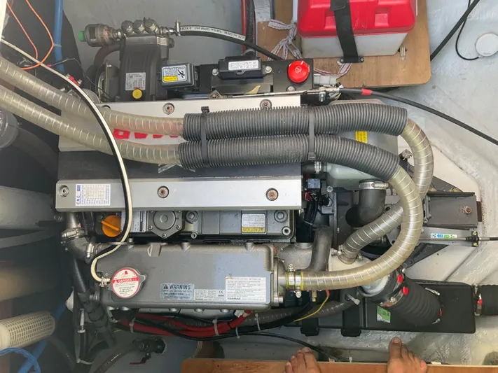 Martina Yacht Photos Pics Engine compartment of a 2021 Lagoon LAGOON 46 catamaran, showcasing mechanical components and wiring.