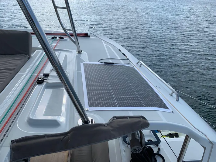 Martina Yacht Photos Pics Solar panel on 2021 Lagoon 46 catamaran deck, overlooking calm water.