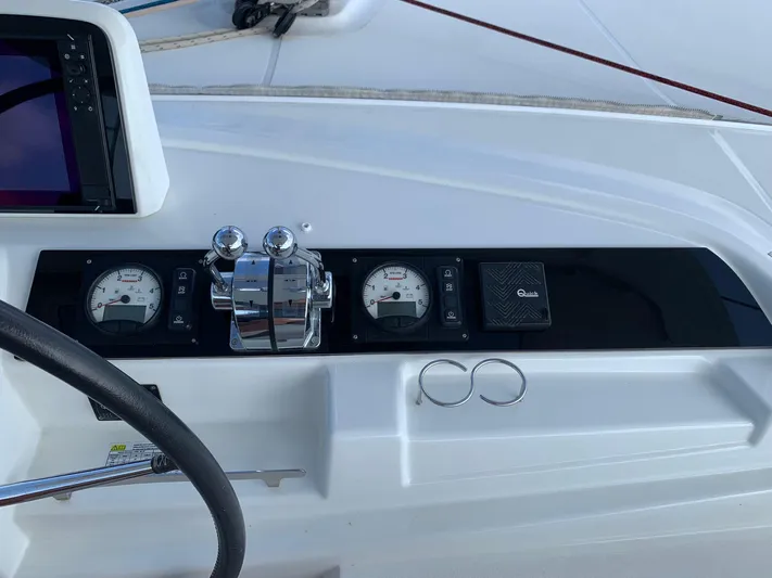 Martina Yacht Photos Pics Control panel of 2021 Lagoon 46 yacht with gauges and throttle levers.