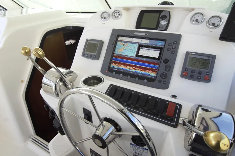 Finn Yacht Photos Pics Helm of 2006 Tiara Yachts 3000 Open with navigation equipment and controls.