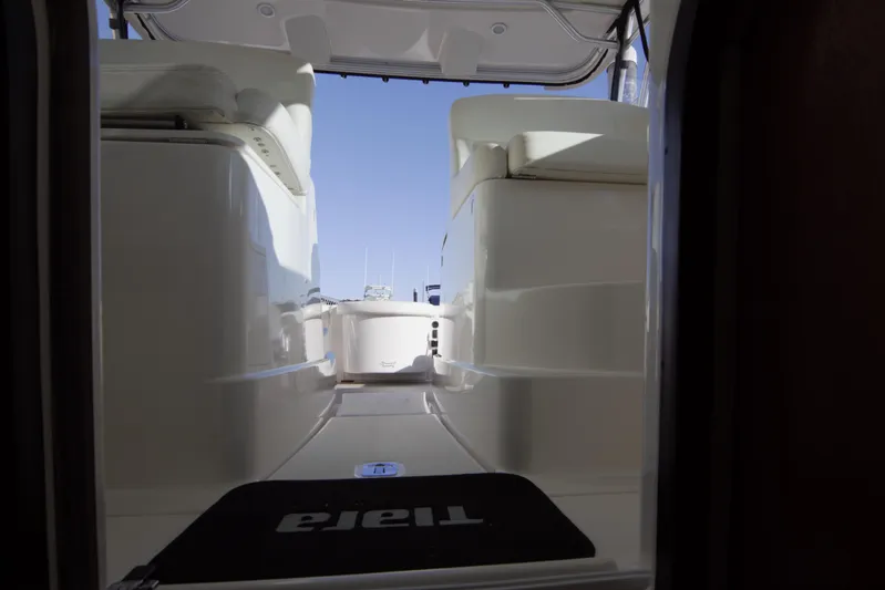 Finn Yacht Photos Pics Interior view of 2006 Tiara Yachts 3000 Open, showcasing sleek seating and deck design.