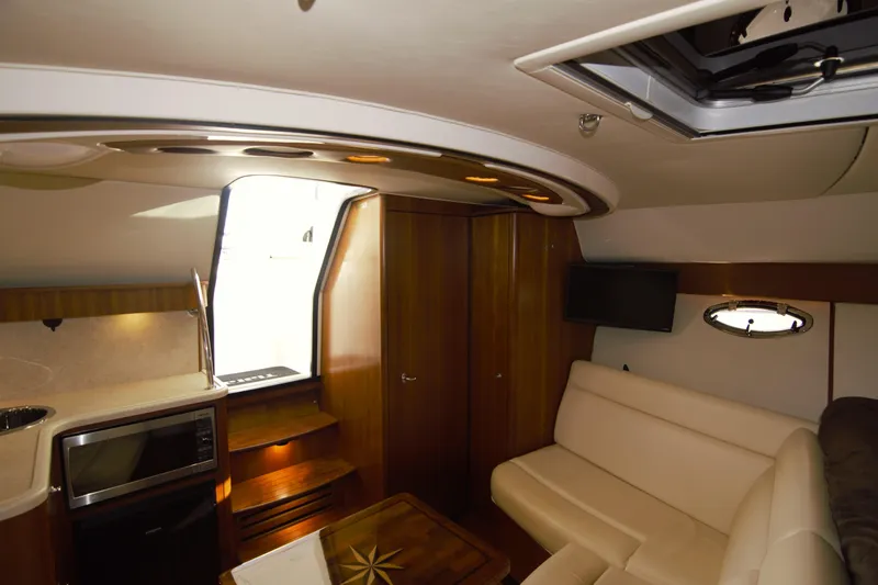 Finn Yacht Photos Pics Luxurious interior of 2006 Tiara Yachts 3000 Open, featuring elegant seating and modern amenities.