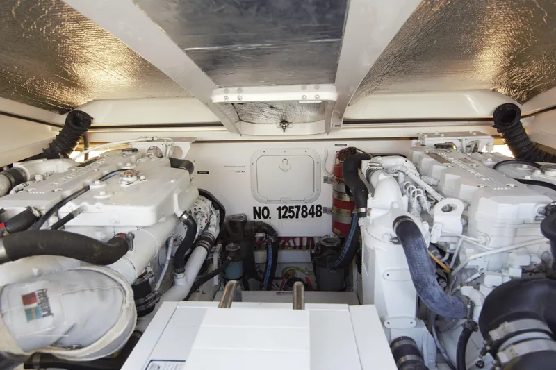 Finn Yacht Photos Pics Engine room of 2006 Tiara Yachts 3000 Open, showcasing dual engines and equipment.