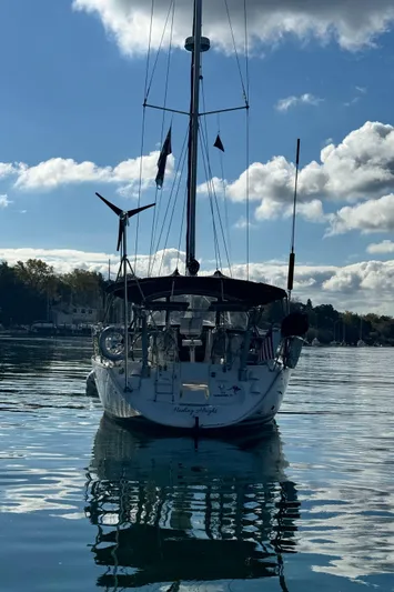 Heeling Alright Yacht Photos Pics 2001 Jeanneau Sun Odyssey 40 sailboat on calm water under a partly cloudy sky.