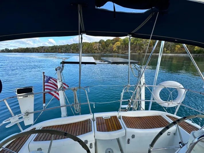 Heeling Alright Yacht Photos Pics Jeanneau Sun Odyssey 40 sailboat cockpit with scenic water view, 2001 model.