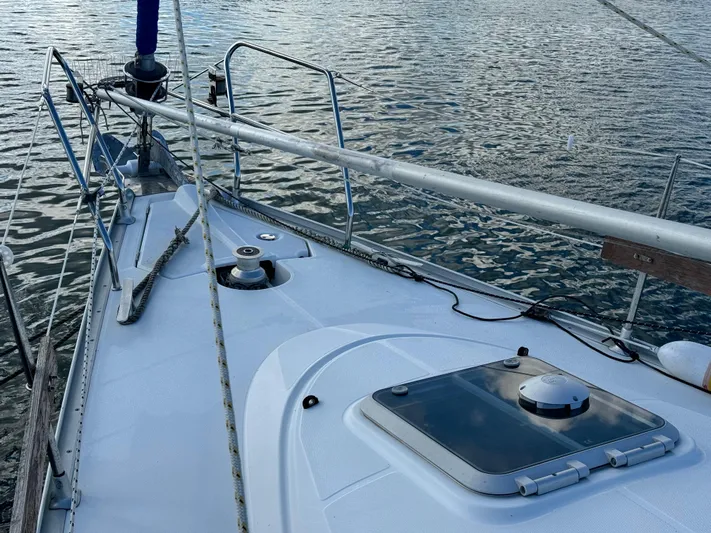 Heeling Alright Yacht Photos Pics Deck view of 2001 Jeanneau Sun Odyssey 40 sailboat on calm water.
