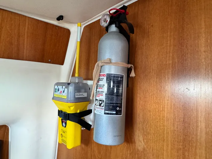 Heeling Alright Yacht Photos Pics Fire extinguisher and emergency beacon on 2001 Jeanneau Sun Odyssey 40 yacht interior.