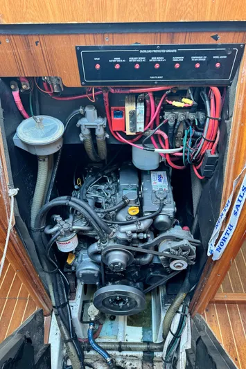 Heeling Alright Yacht Photos Pics Engine compartment of a 2001 Jeanneau Sun Odyssey 40 sailboat, showing wiring and components.