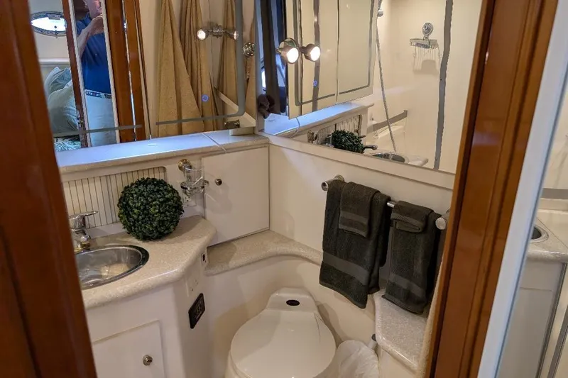 This New Interior Is Amazing! Yacht Photos Pics Bathroom interior of 2003 Carver 356 Motor Yacht with modern fixtures and decor.