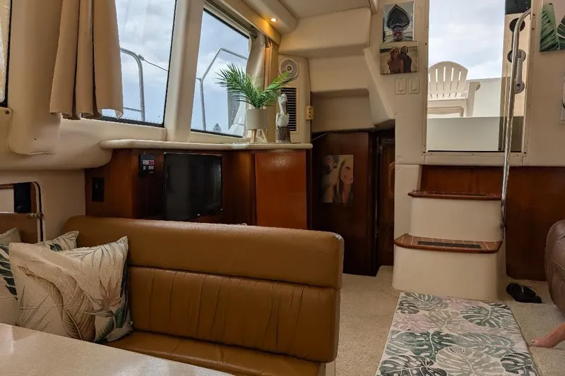 This New Interior Is Amazing! Yacht Photos Pics Interior of 2003 Carver 356 Motor Yacht with cozy seating and decor.