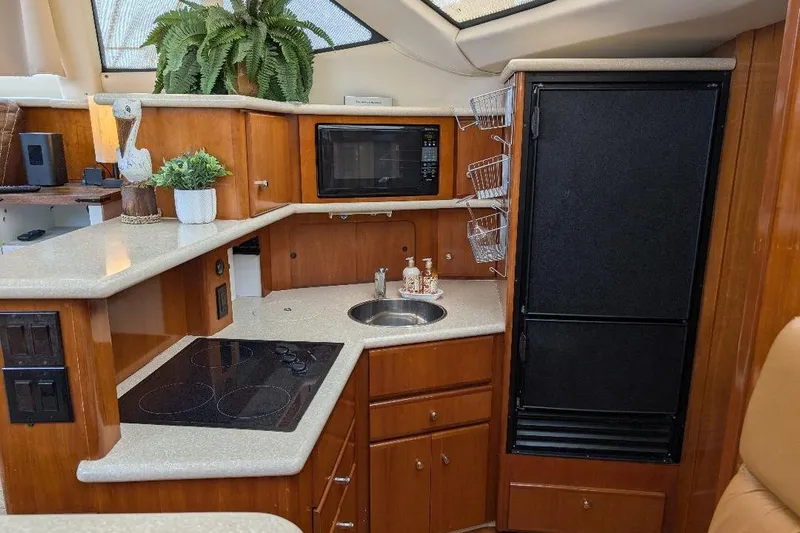 This New Interior Is Amazing! Yacht Photos Pics Luxurious kitchen interior of 2003 Carver 356 Motor Yacht with modern amenities.