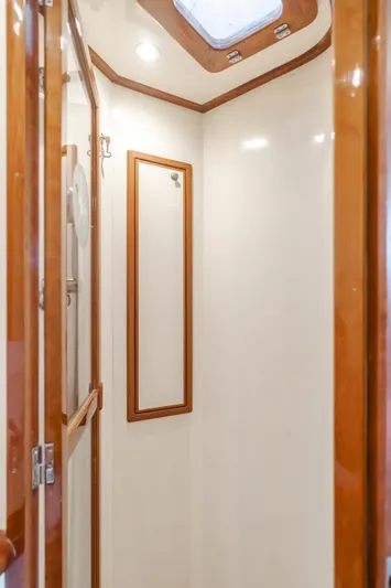 Tribeless Yacht Photos Pics Shower area in 2002 Mikelson 70 Sportfisher yacht with wood trim.