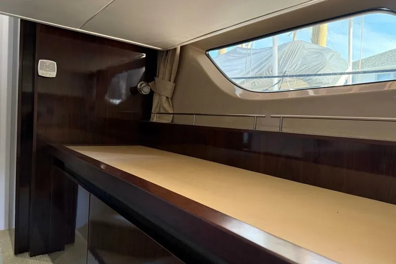 Lady Laura Yacht Photos Pics Interior of 2016 Sea Ray Sundancer 400 yacht with wooden finish and window view.