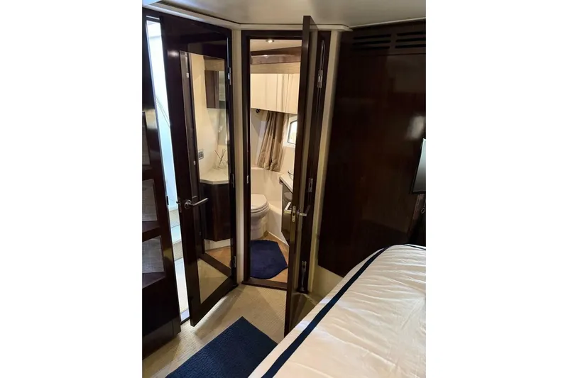 Lady Laura Yacht Photos Pics Luxurious interior of 2016 Sea Ray Sundancer 400 yacht with elegant bathroom and bedroom.