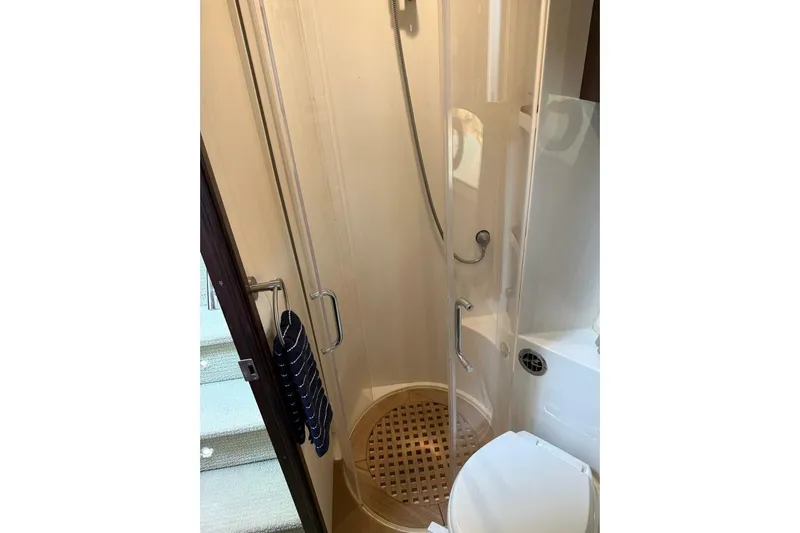 Lady Laura Yacht Photos Pics Bathroom interior of 2016 Sea Ray Sundancer 400 yacht, featuring shower and toilet.