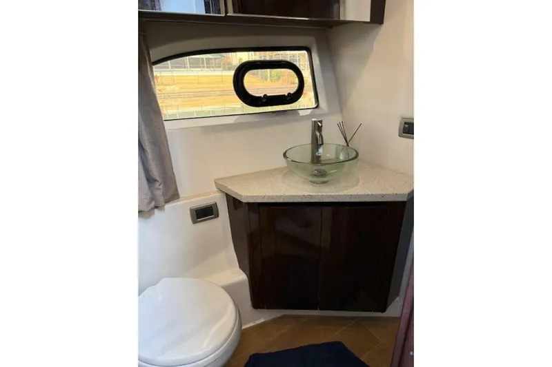 Lady Laura Yacht Photos Pics Bathroom interior of 2016 Sea Ray Sundancer 400 yacht with modern sink and window.