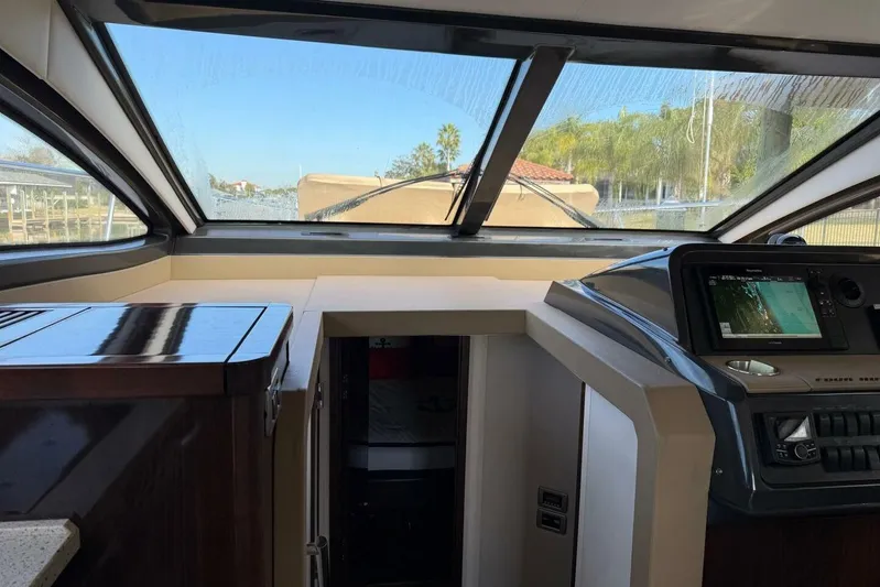 Lady Laura Yacht Photos Pics Interior view of 2016 Sea Ray Sundancer 400 yacht cockpit with navigation system.