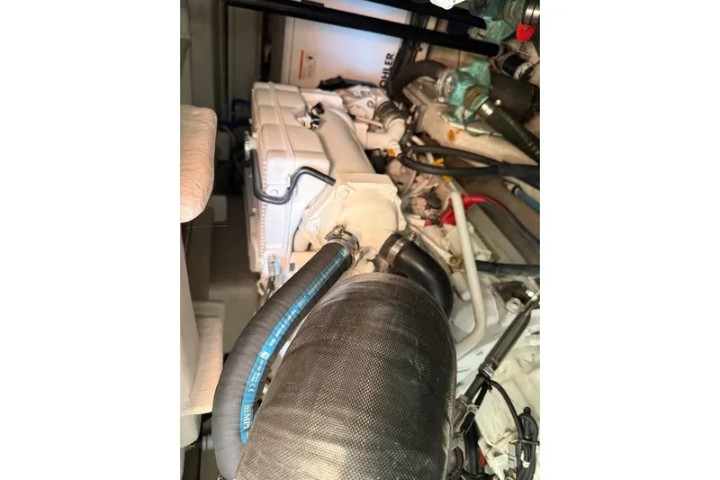 Lady Laura Yacht Photos Pics Engine compartment of a 2016 Sea Ray Sundancer 400 boat, showcasing mechanical components.