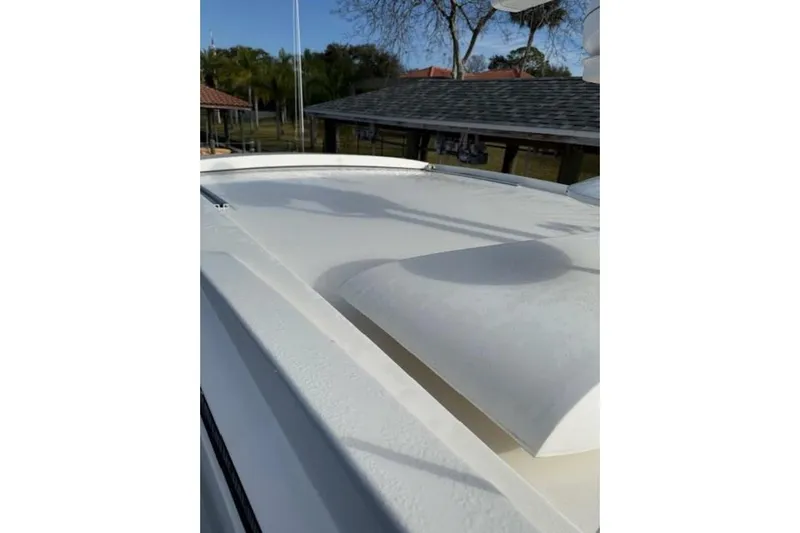 Lady Laura Yacht Photos Pics 2016 Sea Ray Sundancer 400 boat deck with clear sky and trees in background.