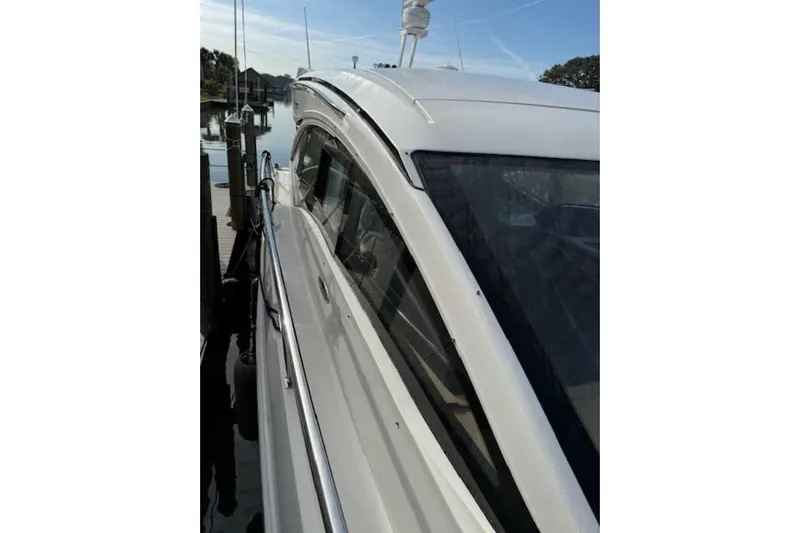 Lady Laura Yacht Photos Pics 2016 Sea Ray Sundancer 400 yacht docked, showcasing sleek design and modern features.