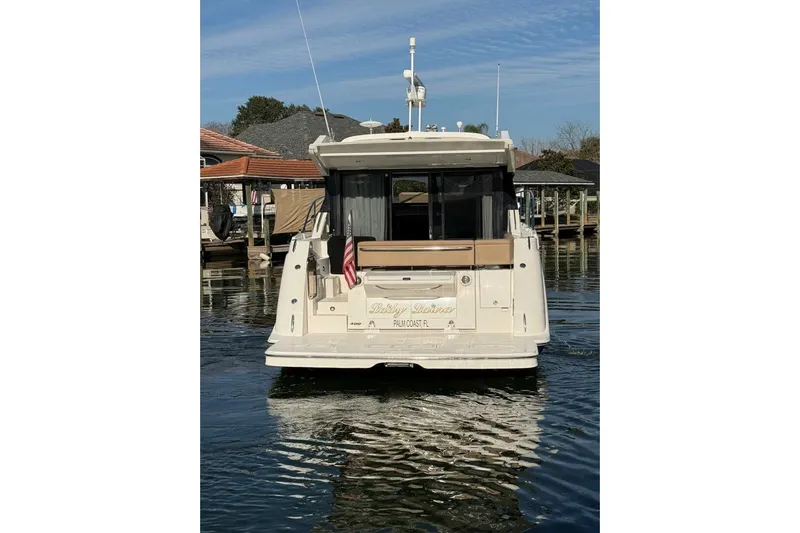 Lady Laura Yacht Photos Pics 2016 Sea Ray Sundancer 400 yacht docked in a marina, rear view.