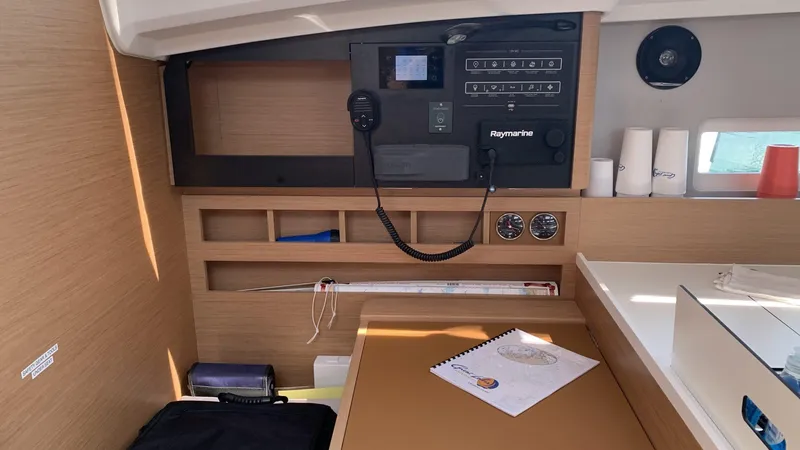 Flyin Yacht Photos Pics Navigation station on 2020 Jeanneau Sun Odyssey 410 yacht with Raymarine equipment.