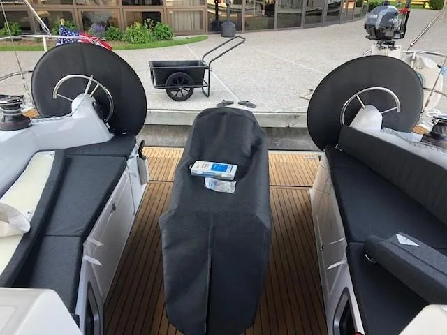 Flyin Yacht Photos Pics Jeanneau Sun Odyssey 410 cockpit with covered helm, 2020 model, docked with accessories.