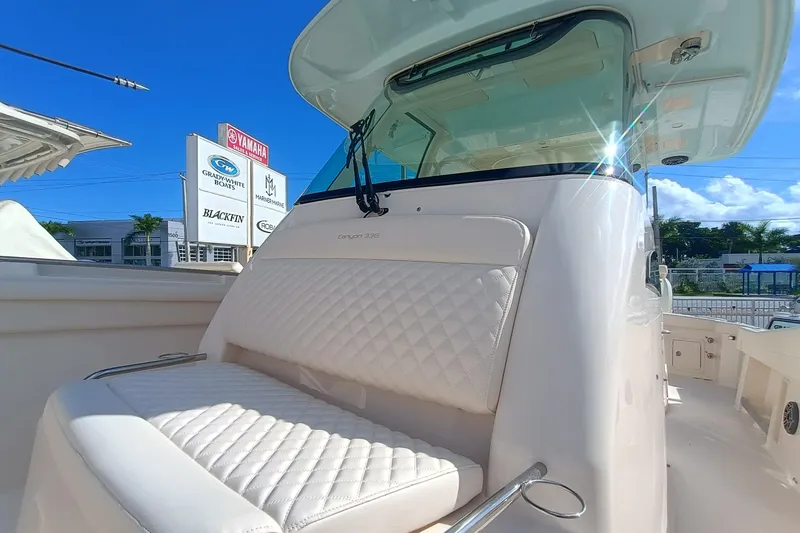 336-617 Yacht Photos Pics 2026 Grady-White Canyon 336 boat with cushioned seating and sunshine.