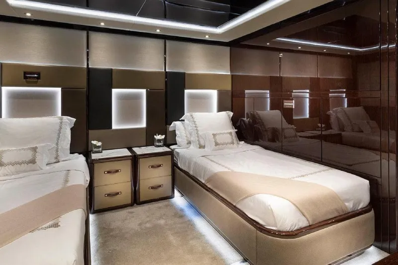 M/y Nexus Yacht Photos Pics Luxurious twin bedroom on 2019 Sunseeker 40 Metre Yacht, featuring elegant design and ambient lighting.