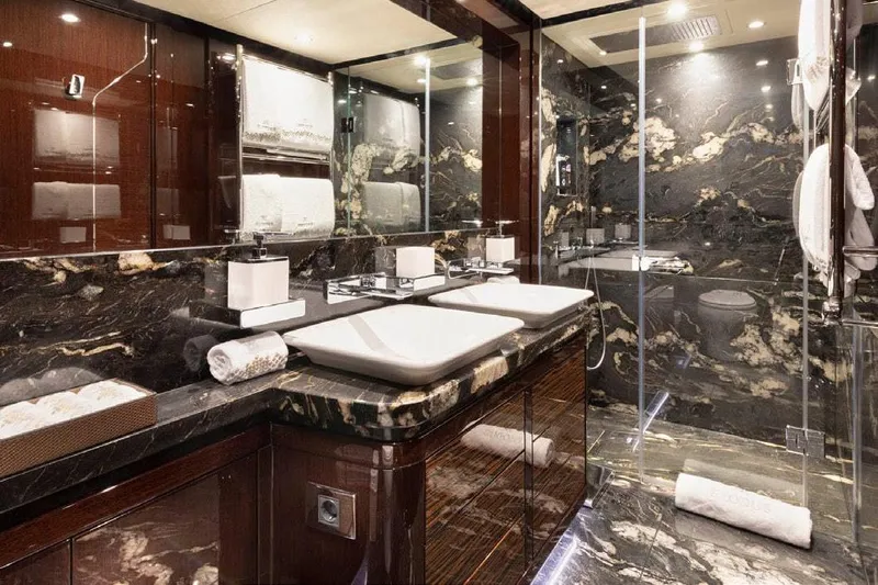 M/y Nexus Yacht Photos Pics Luxurious bathroom in 2019 Sunseeker 40 Metre Yacht with elegant marble and modern fixtures.