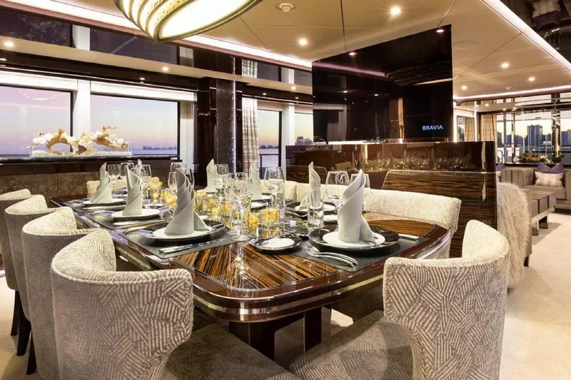 M/y Nexus Yacht Photos Pics Luxurious dining area on a 2019 Sunseeker 40 Metre Yacht, elegantly set for guests.
