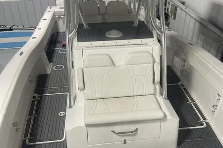  Yacht Photos Pics 2022 Prowler 31 boat interior with white seating and sleek design.