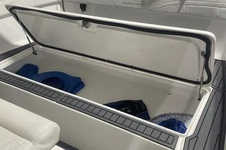 Yacht Photos Pics Open storage compartment in 2022 Prowler 31 boat, containing blue life jackets.